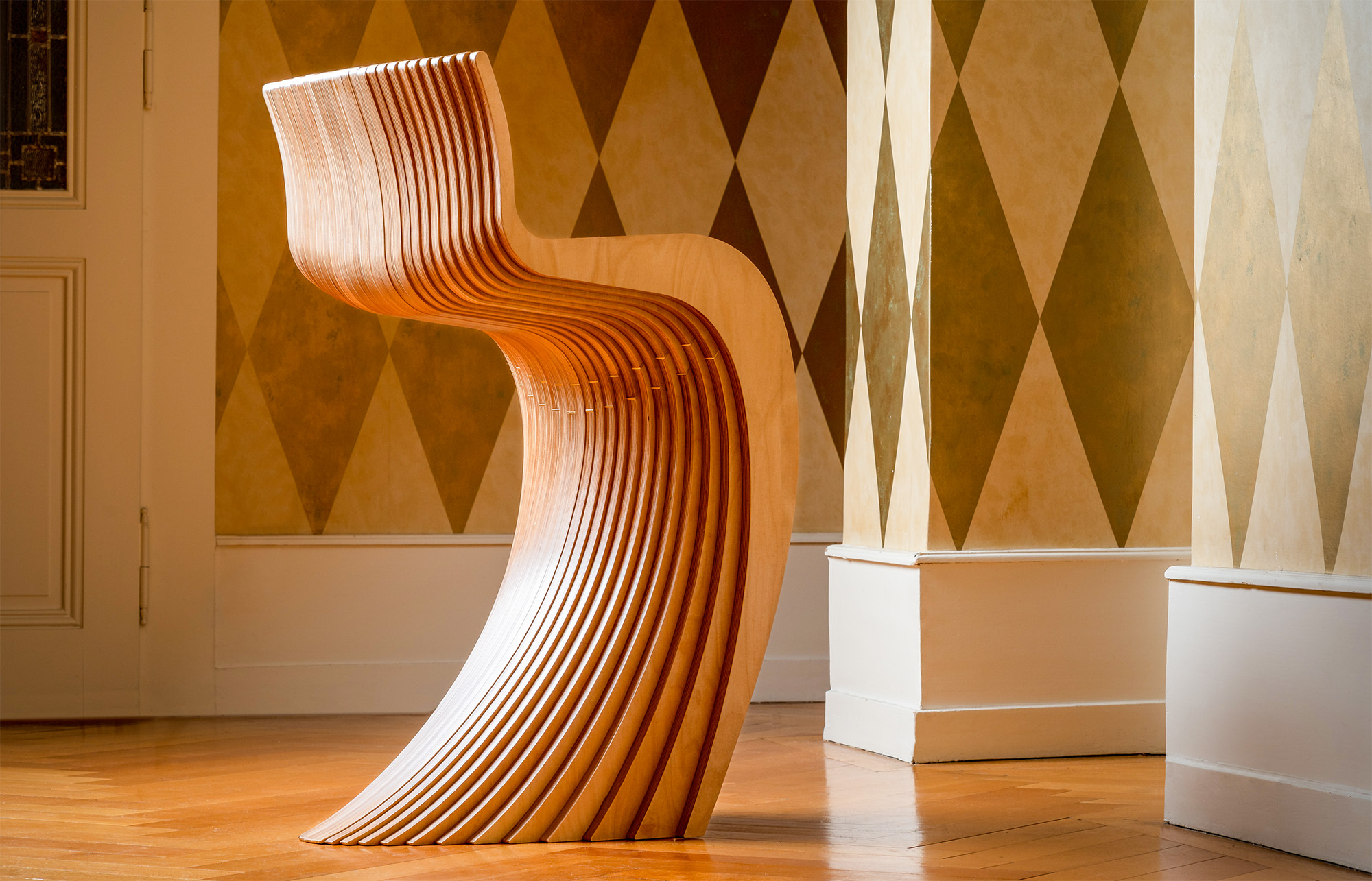 Stratum sculptural stool — laminated wood form